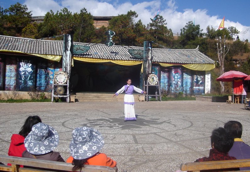 Folk Singer in traditional dress at Dongba Cultural Village